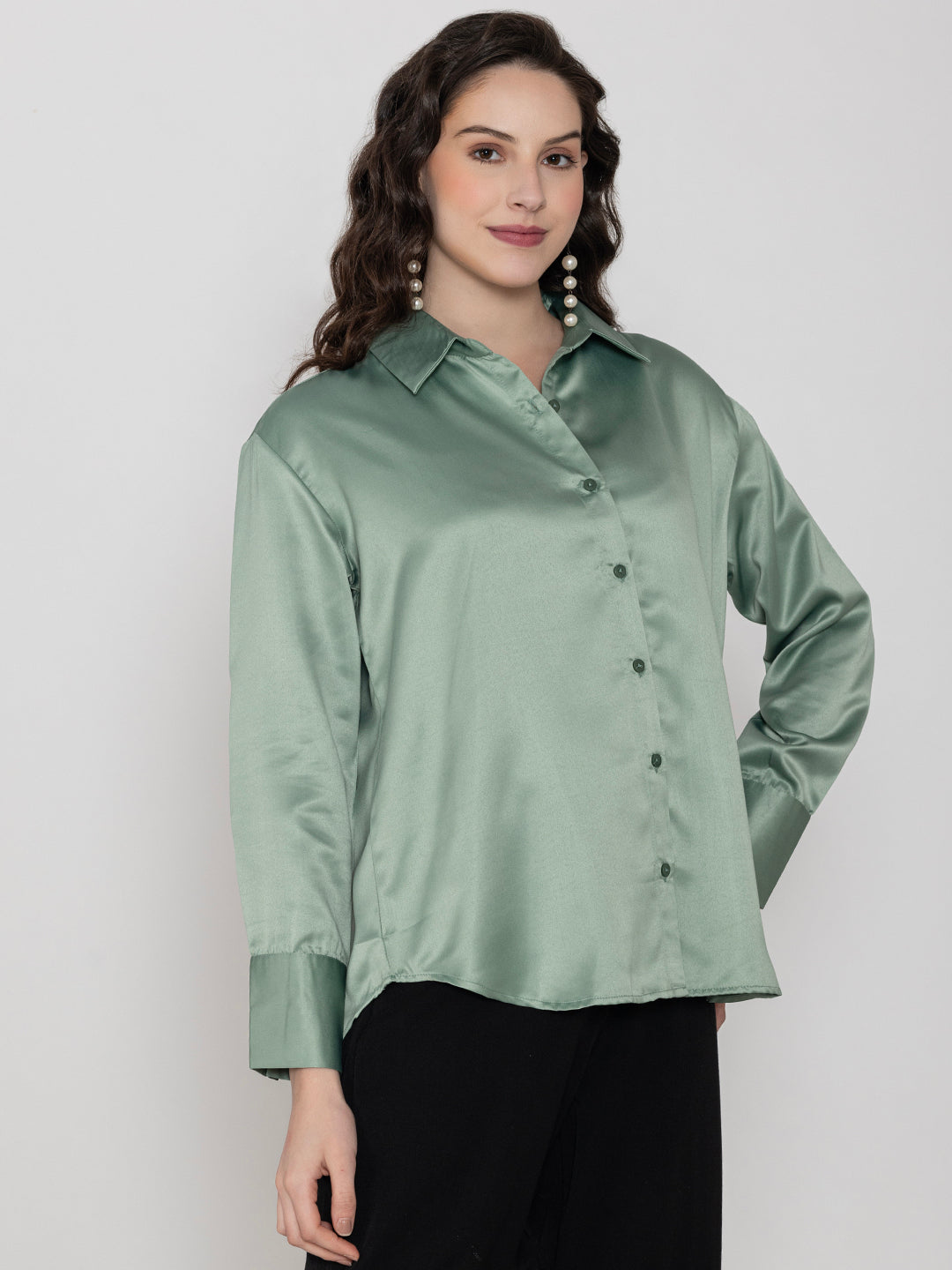 Detail of light green satin sleeve cuff