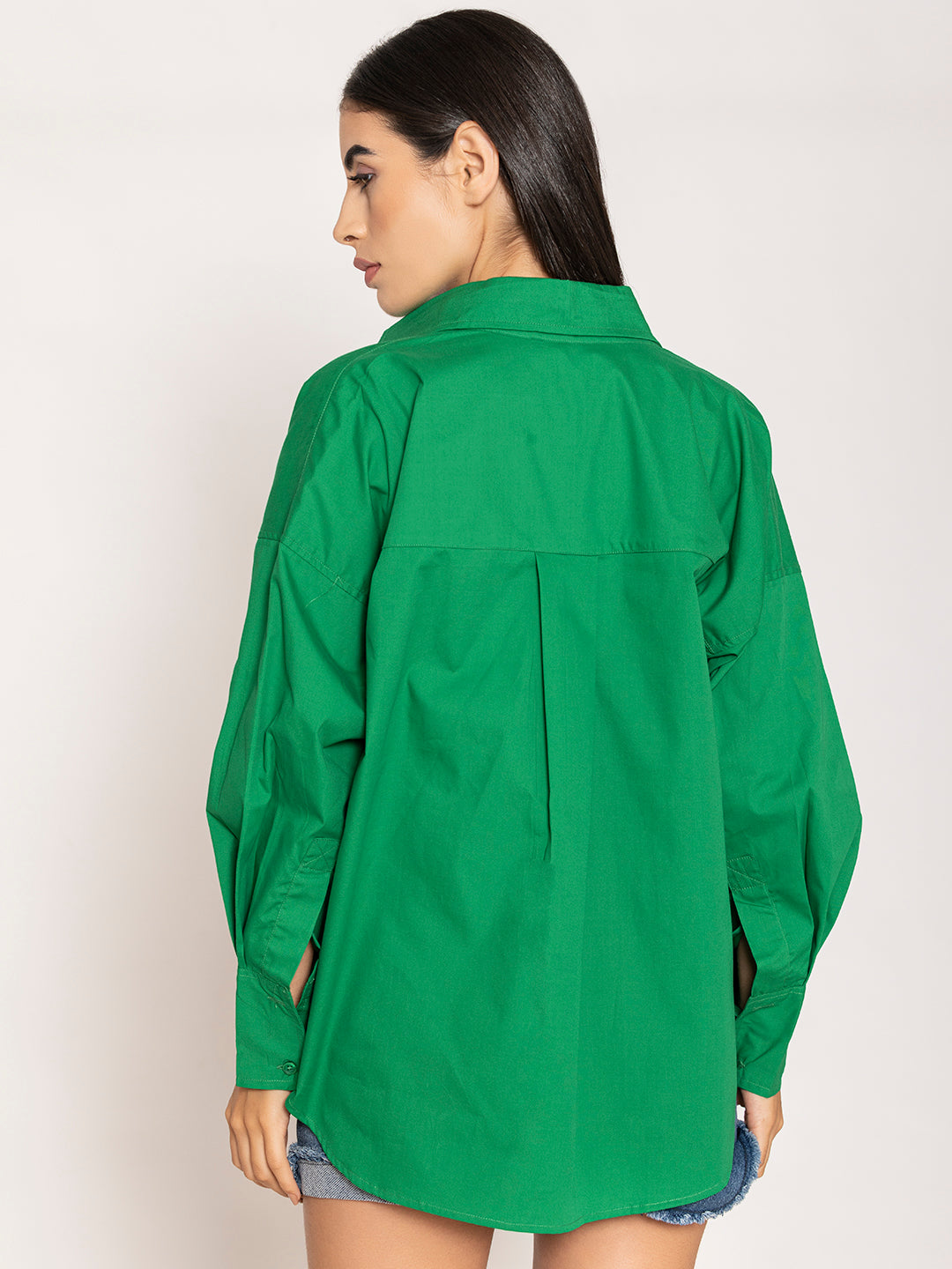 Buttoned cuff detail on green poplin shirt