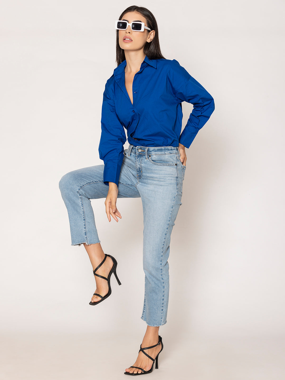 Lifestyle shot of royal blue poplin oversized shirt