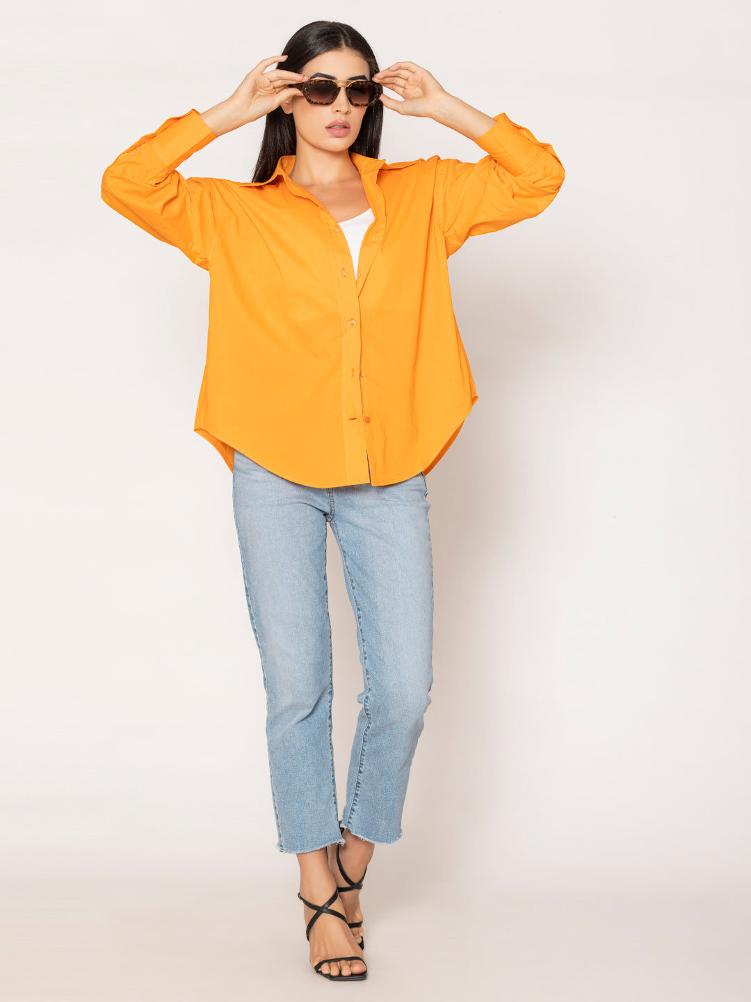 Buttoned cuff detail on orange poplin shirt