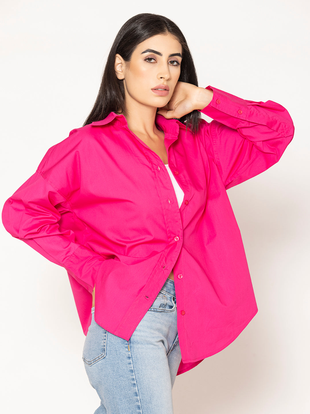 Lifestyle shot of hot pink poplin oversized shirt