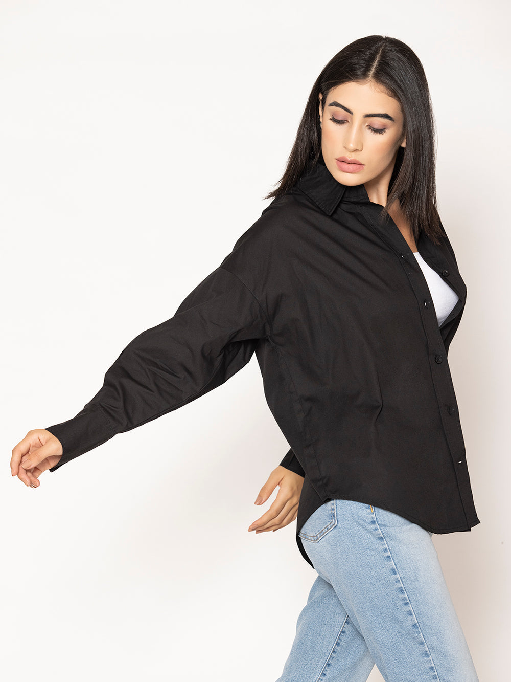 Side view of black oversized poplin shirt with relaxed drop shoulders