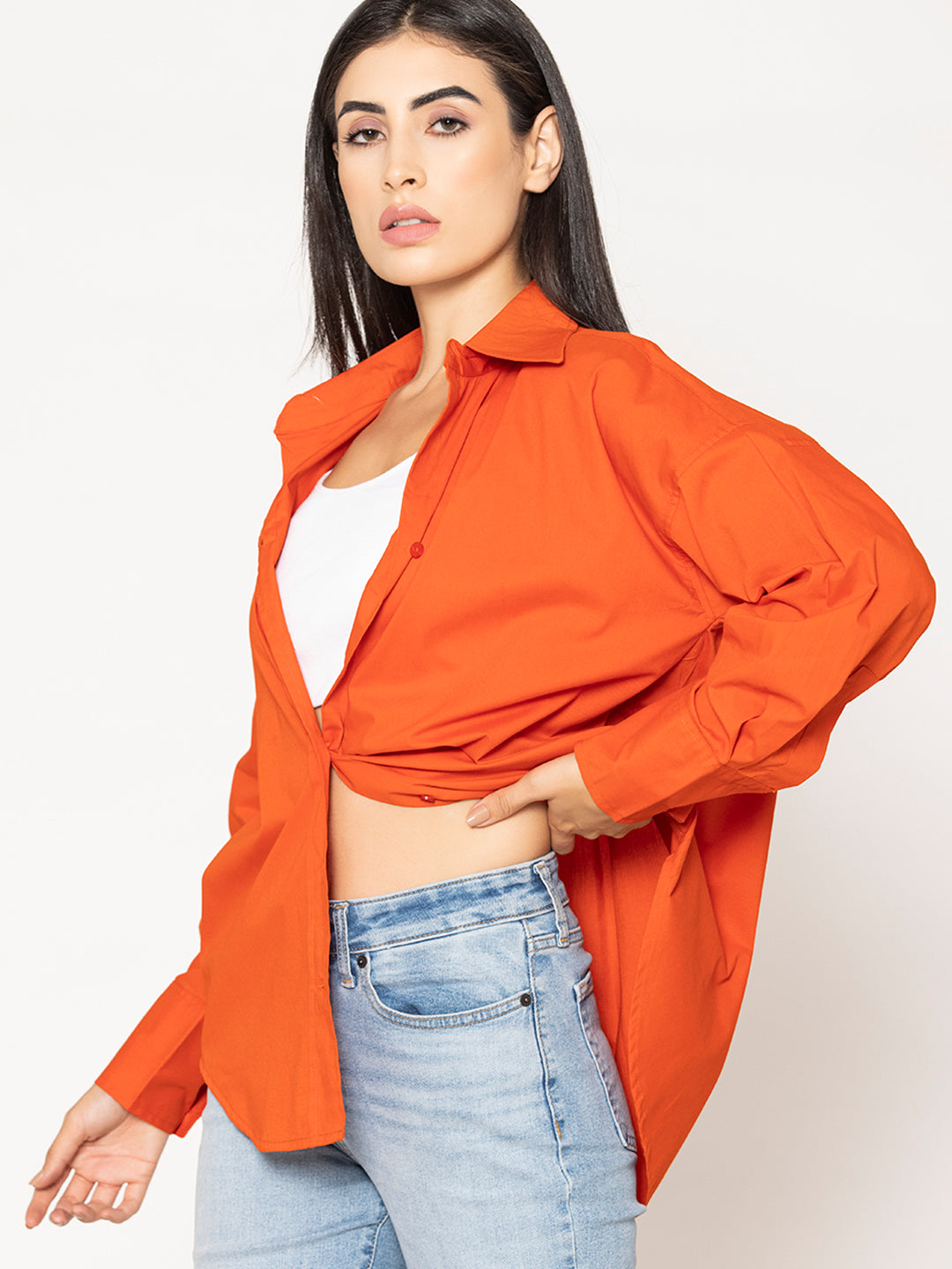 Buttoned cuff detail on rust poplin shirt