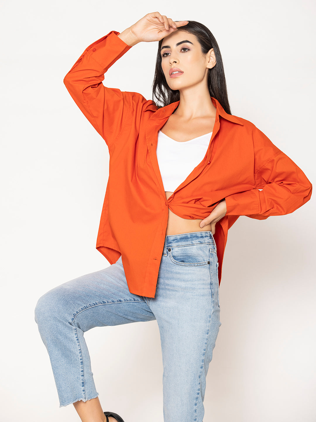 Curved hem detail on rust poplin shirt