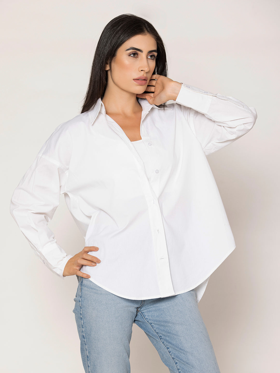 Buttoned cuff detail on white poplin oversized shirt