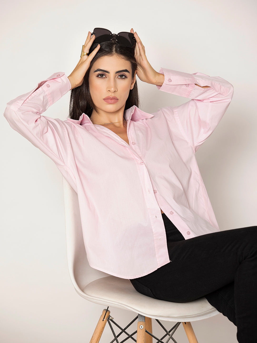 Buttoned cuff detail on light pink poplin shirt