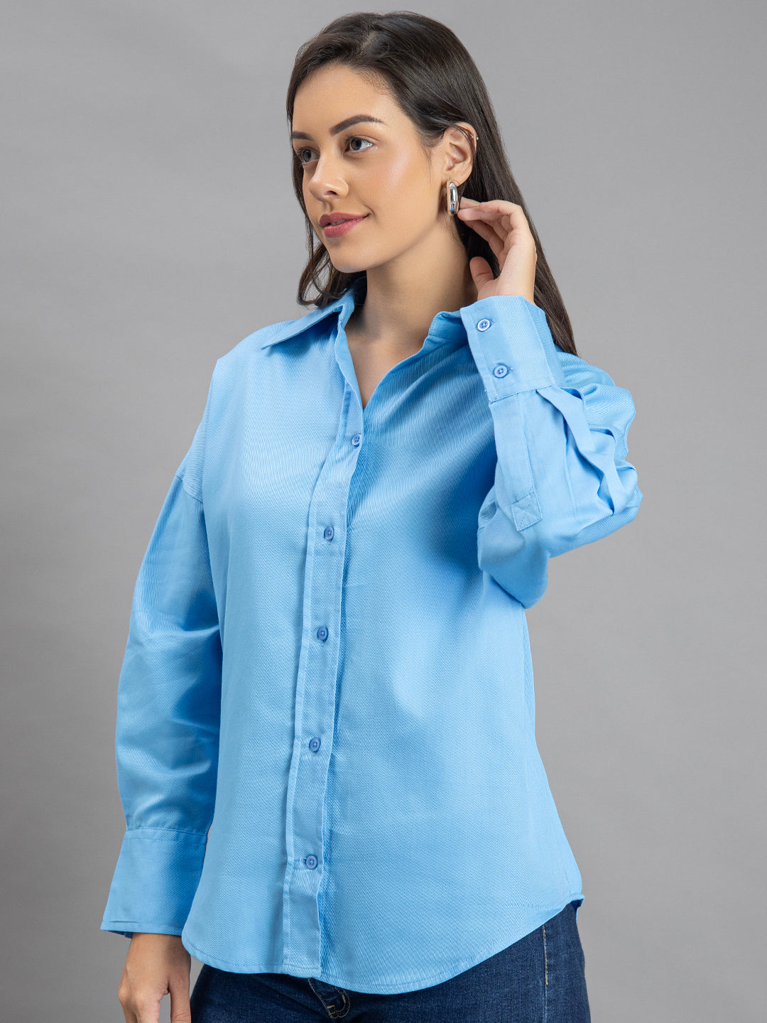 Detail of buttoned cuffs on sky blue twill shirt