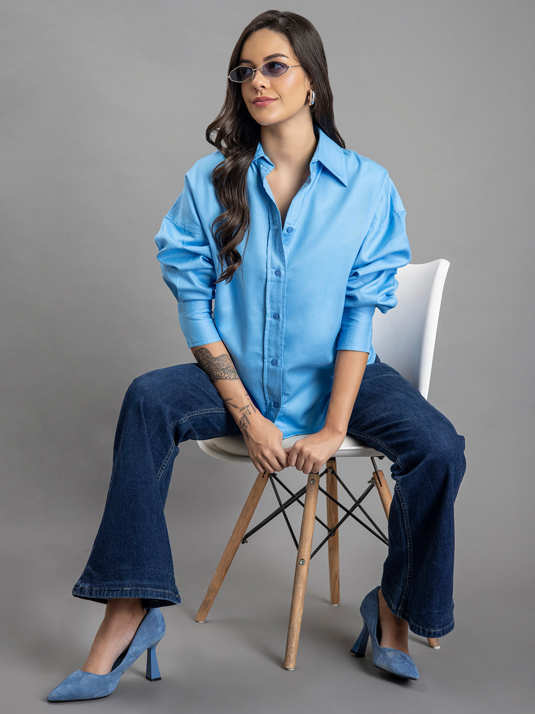 Model wearing sky blue oversized cotton shirt outdoors