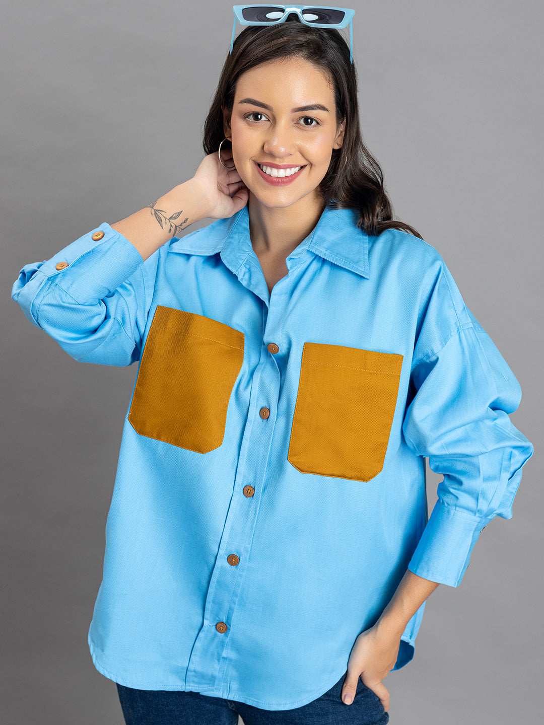 Close-up of chest pocket on sky blue twill shirt
