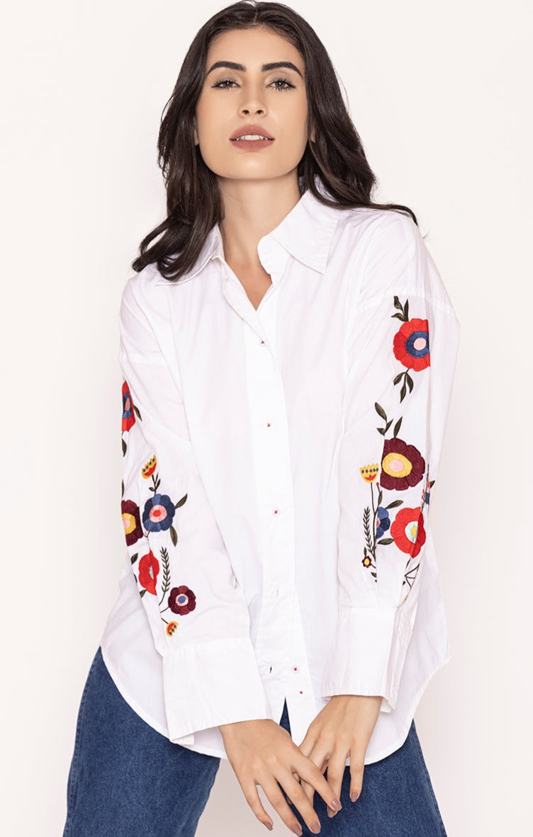 Front view of white embroidered cotton oversized shirt for women