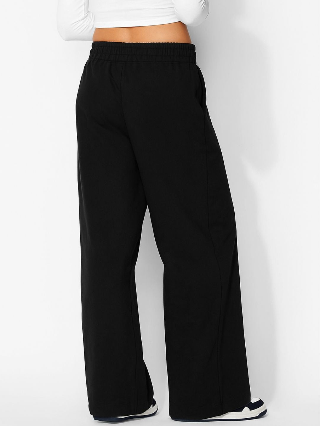 Back view of black track pants