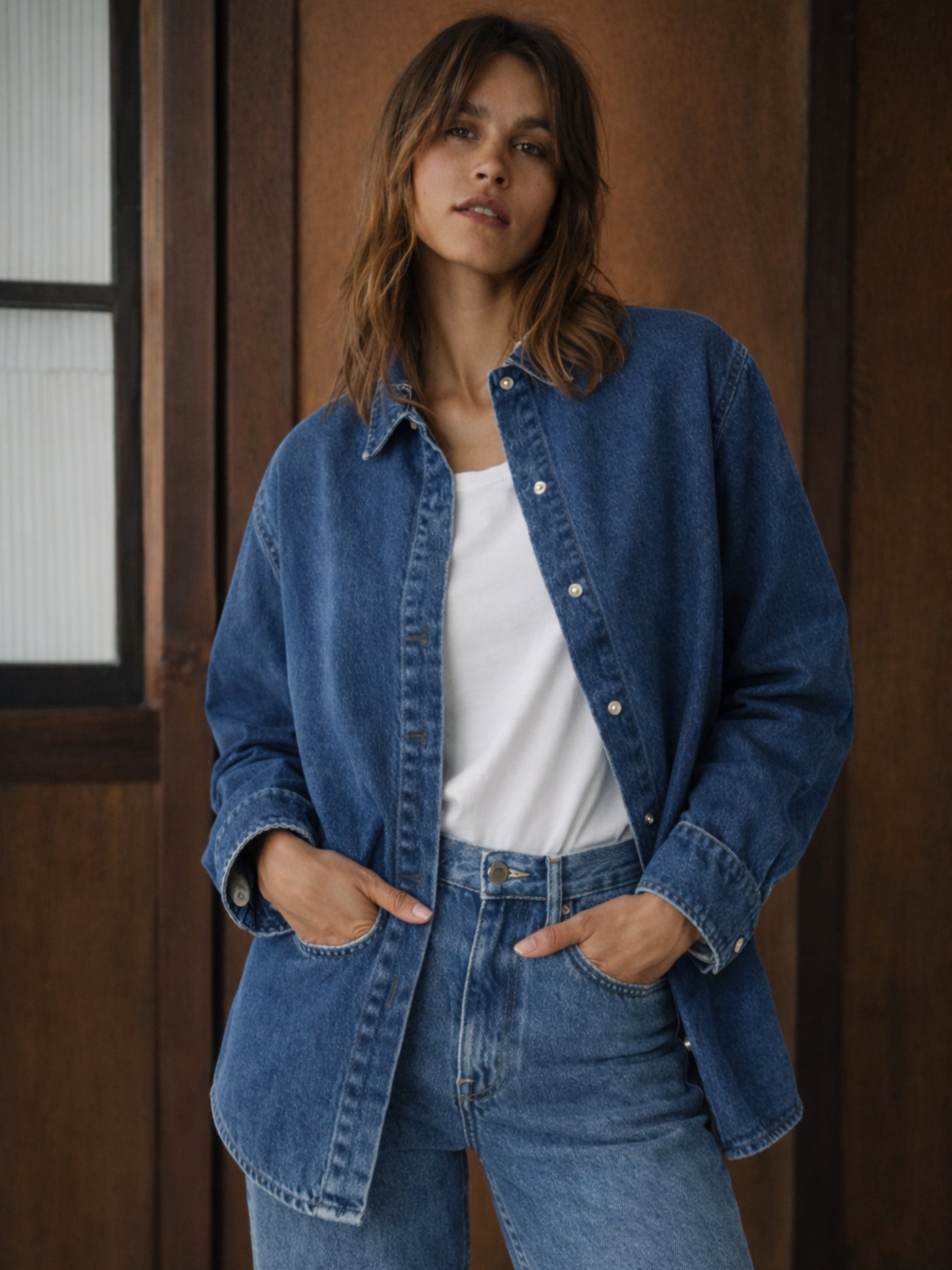 Close-up of spread collar on dark blue denim shirt