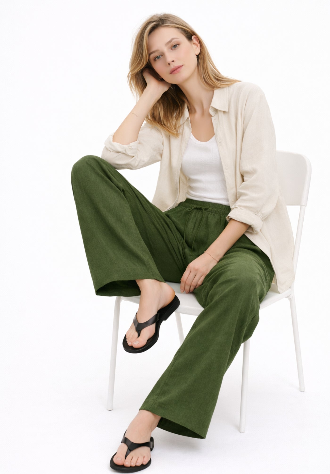 Detail of olive trousers drawstring waistband