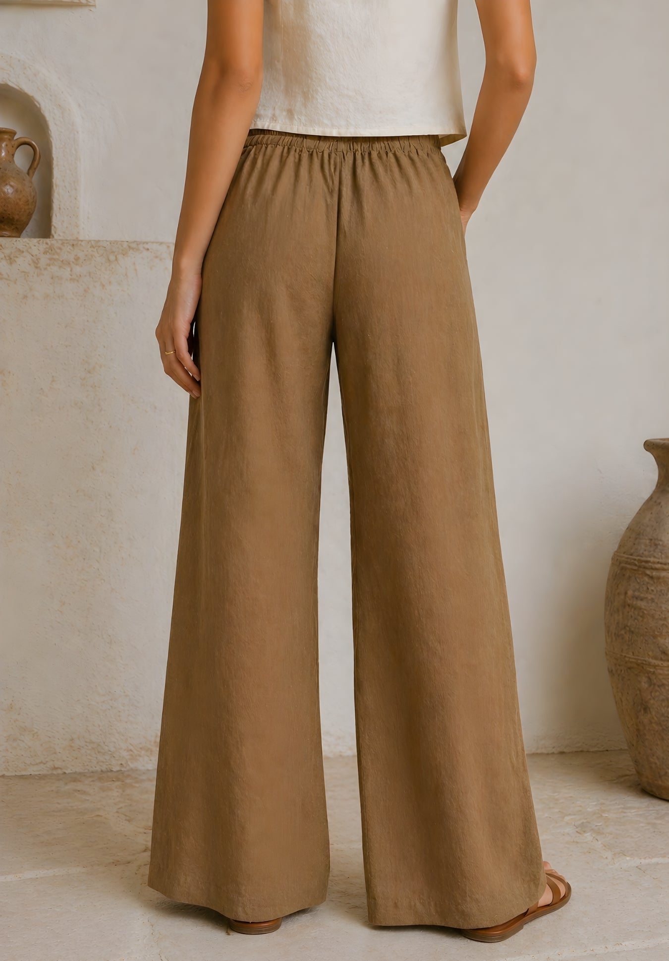 Full-length view of taupe linen-blend mid-rise trousers