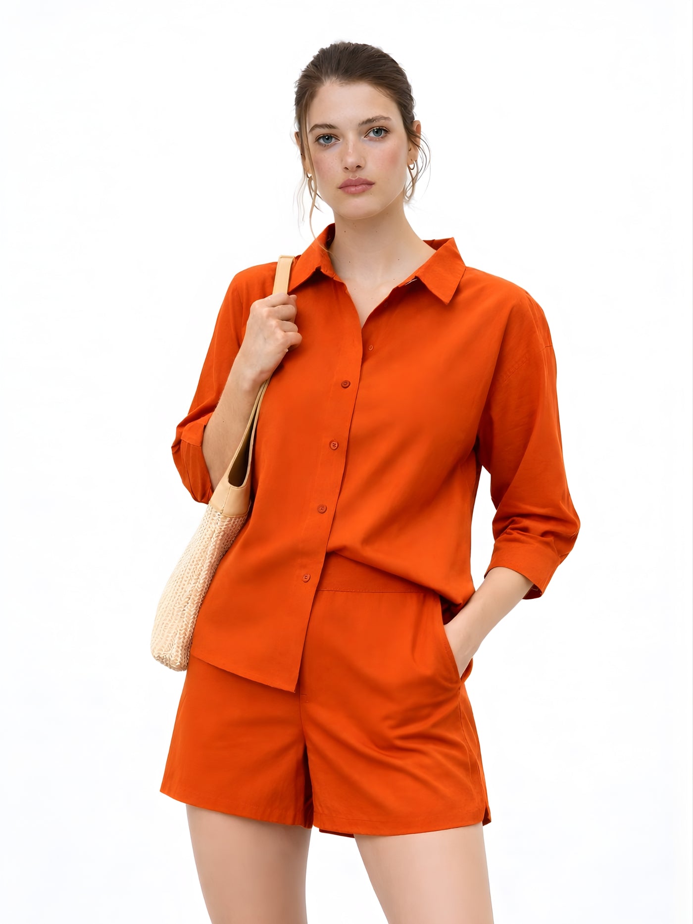 Front view of woman in rust poplin cotton shorts co-ord set