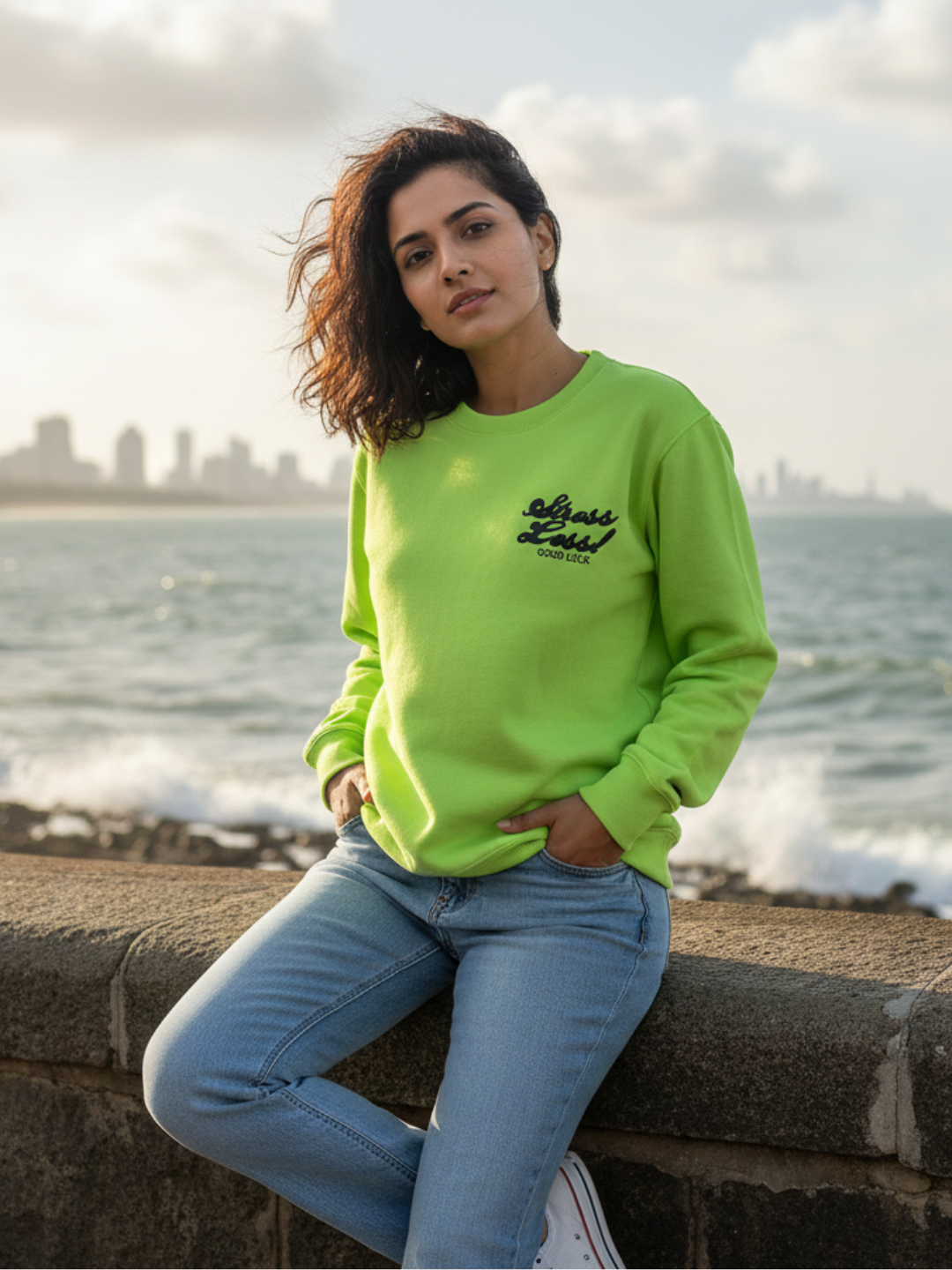 Front view of neon green relaxed sweatshirt for women