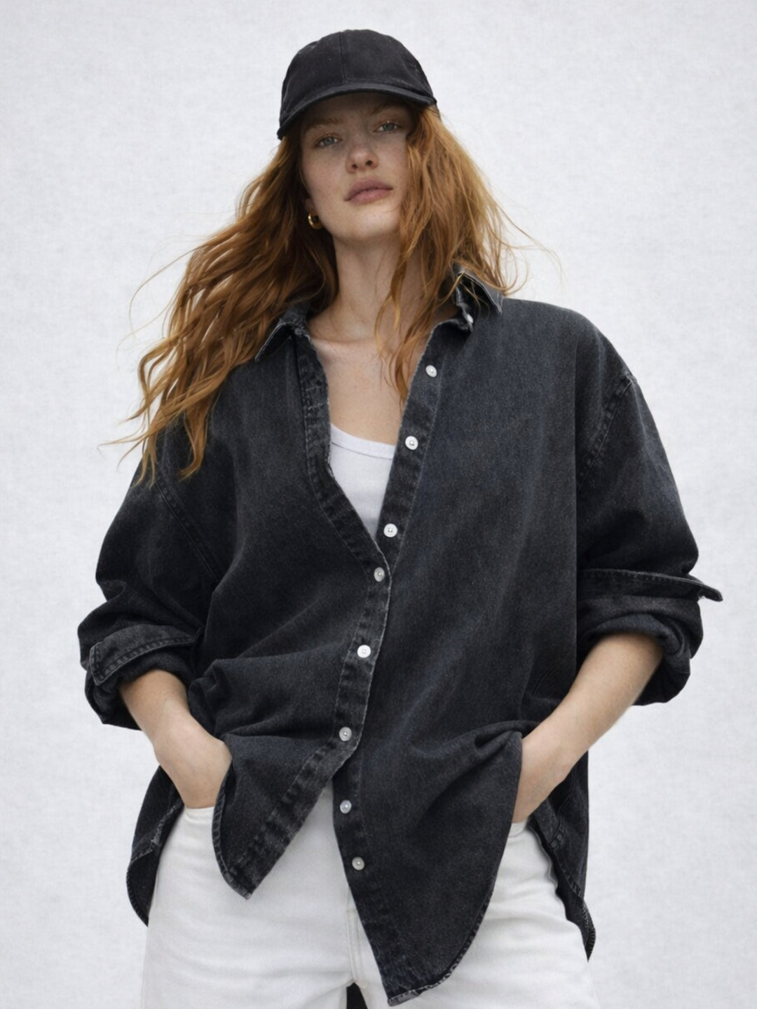 Front view of black oversized denim-style cotton shirt for women