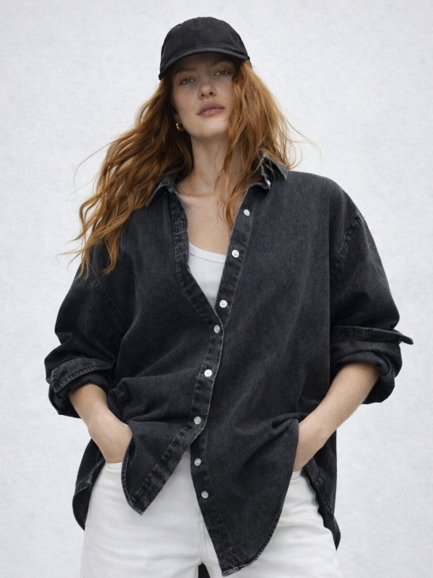 Front view of black oversized denim-style cotton shirt for women