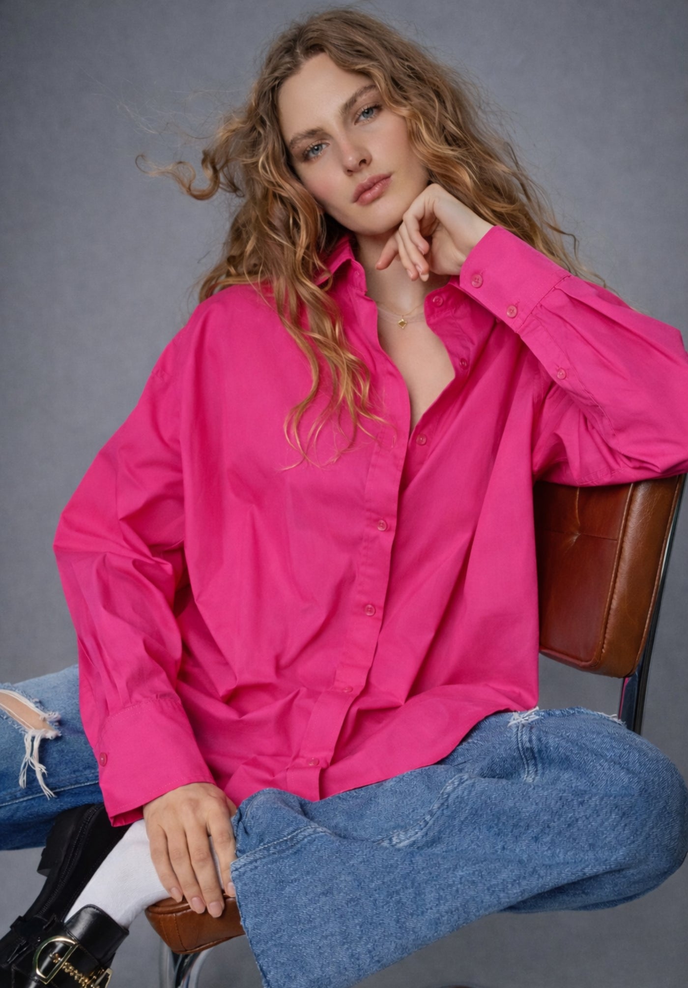 Front view of hot pink cotton poplin oversized shirt for women