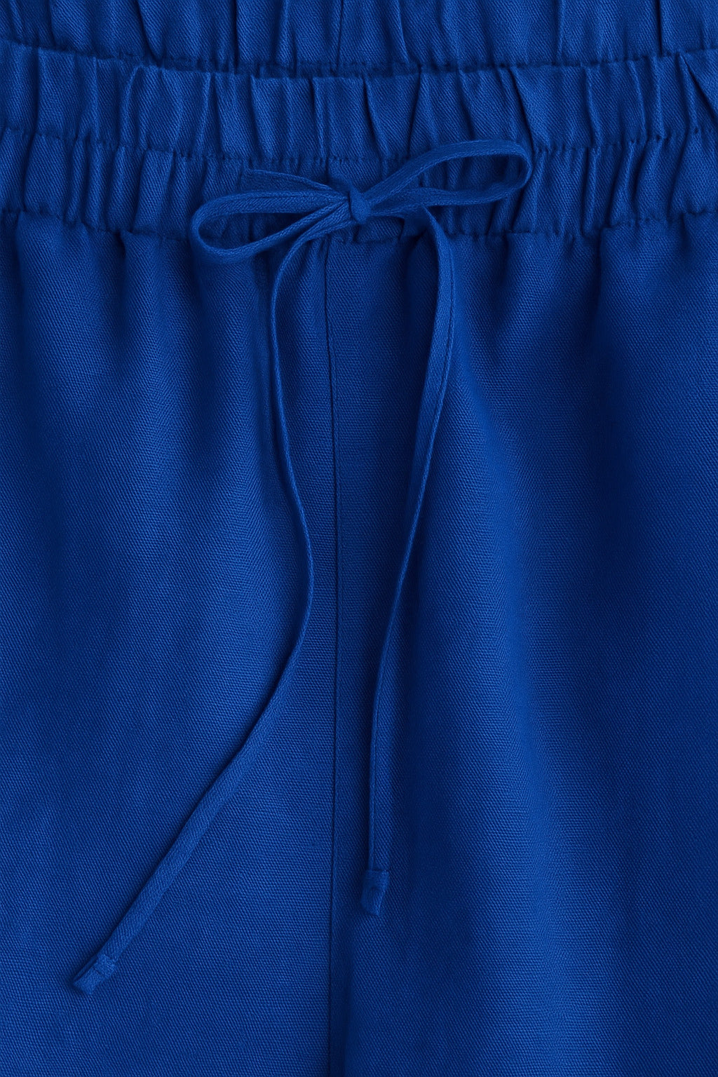Back view of blue baggy trousers with relaxed straight legs