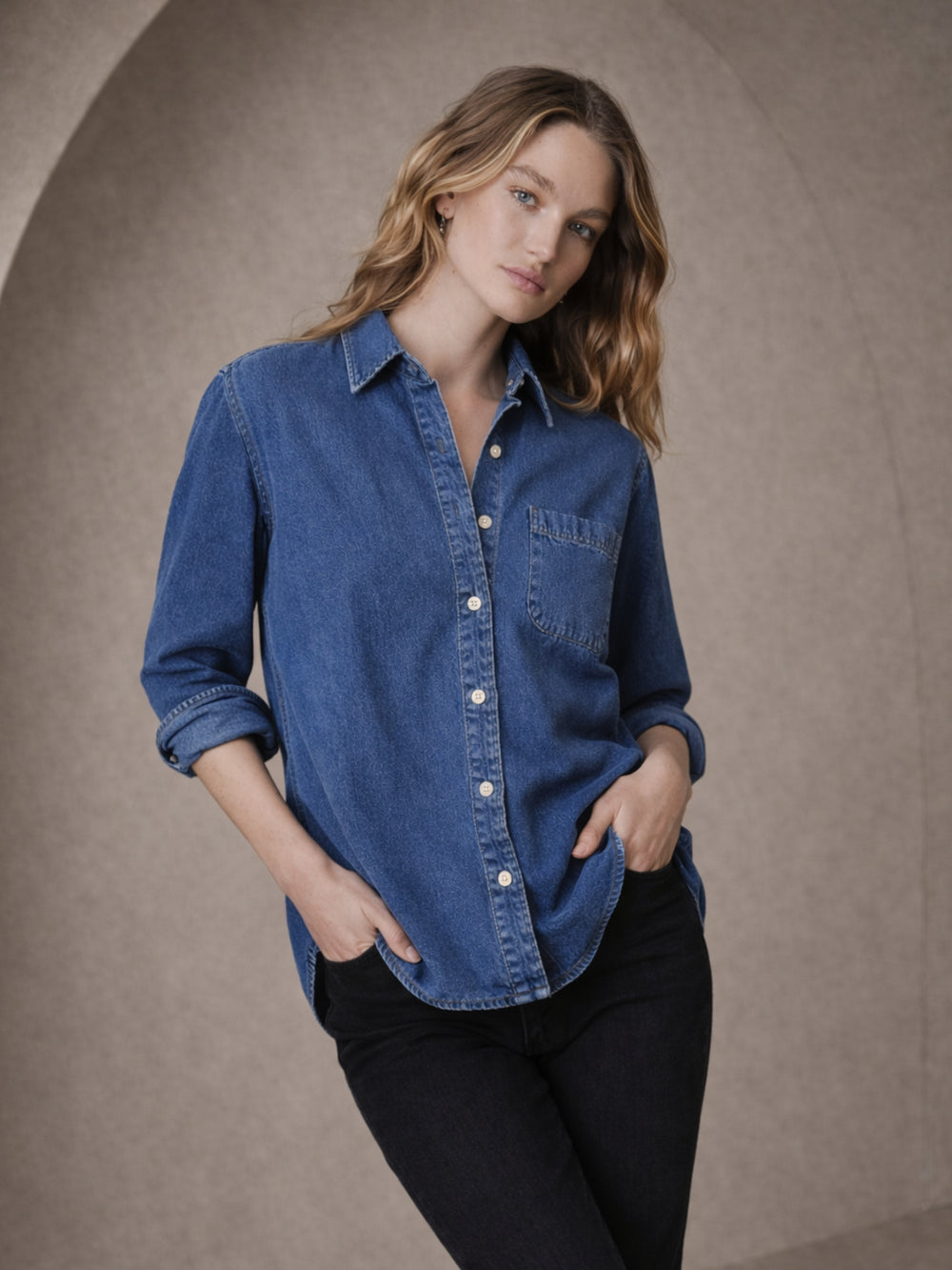 Side angle of dark blue denim shirt with relaxed fit