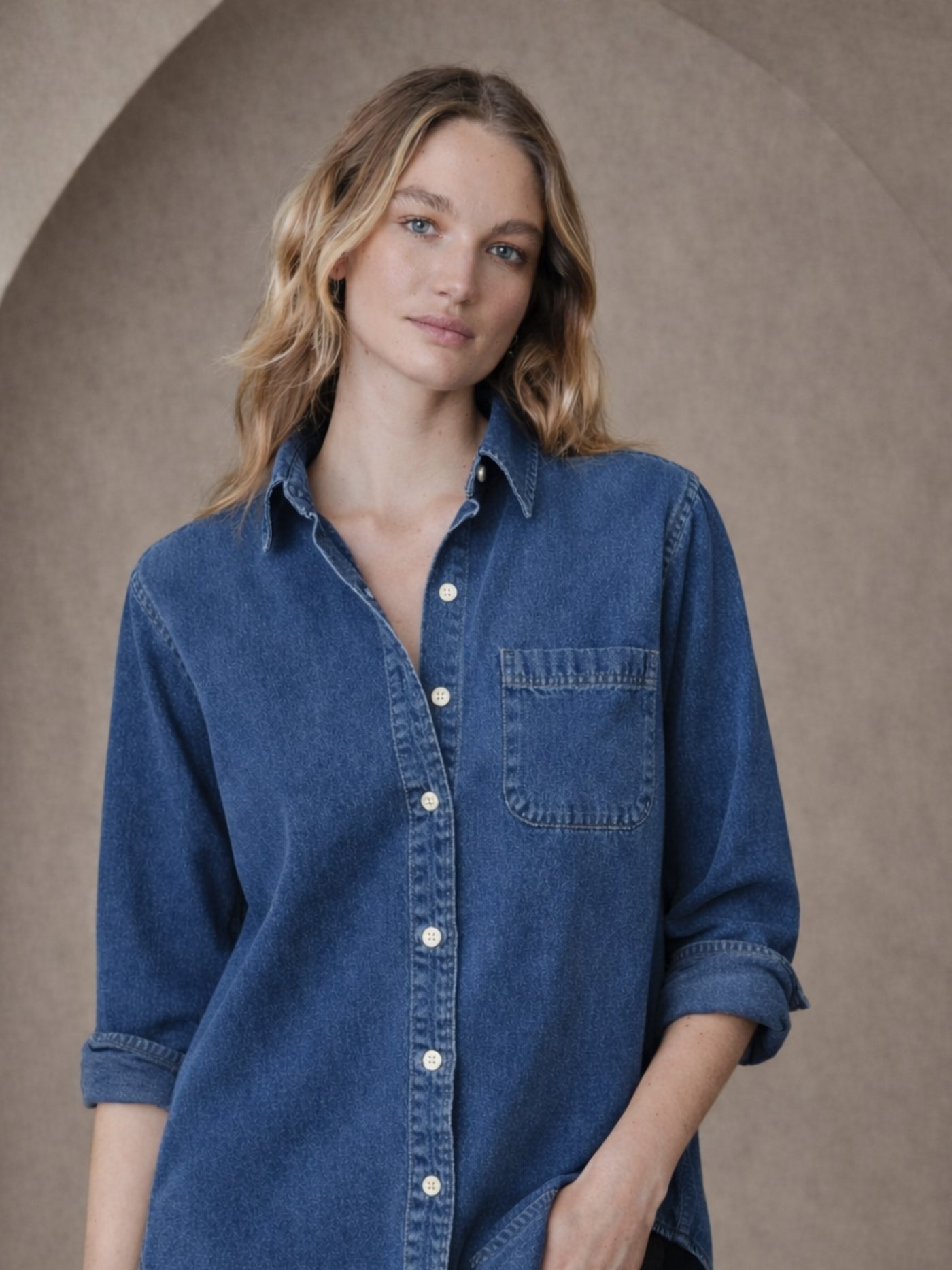 Close-up of spread collar on dark blue denim shirt