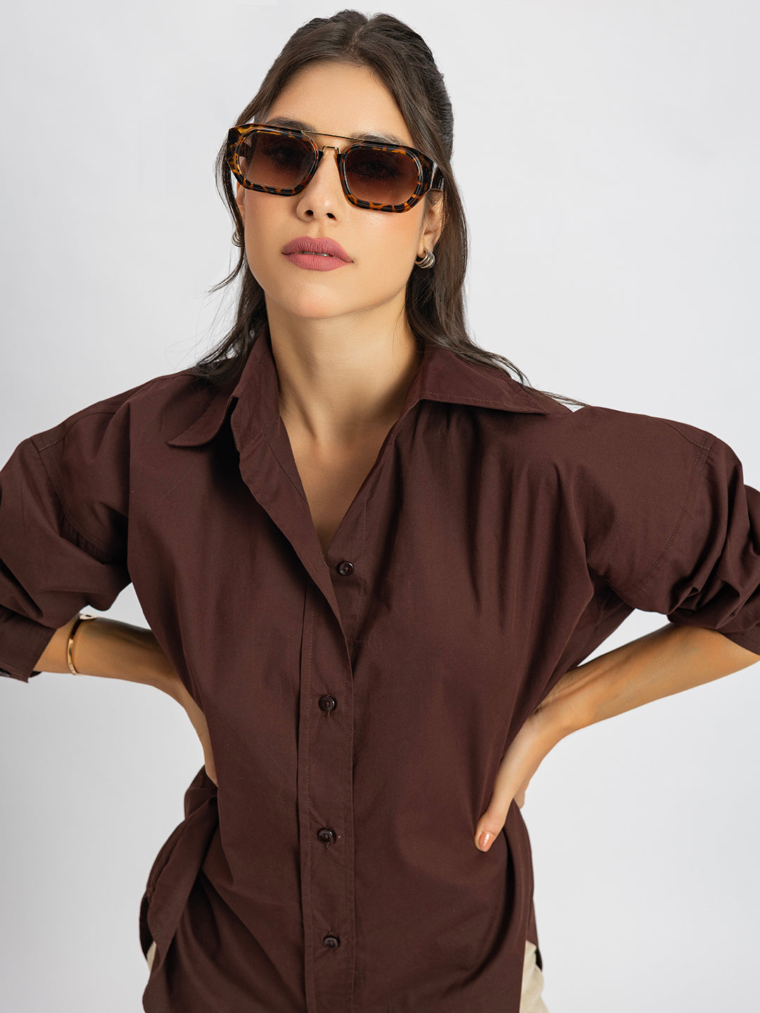 Detail of spread collar on coffee brown shirt