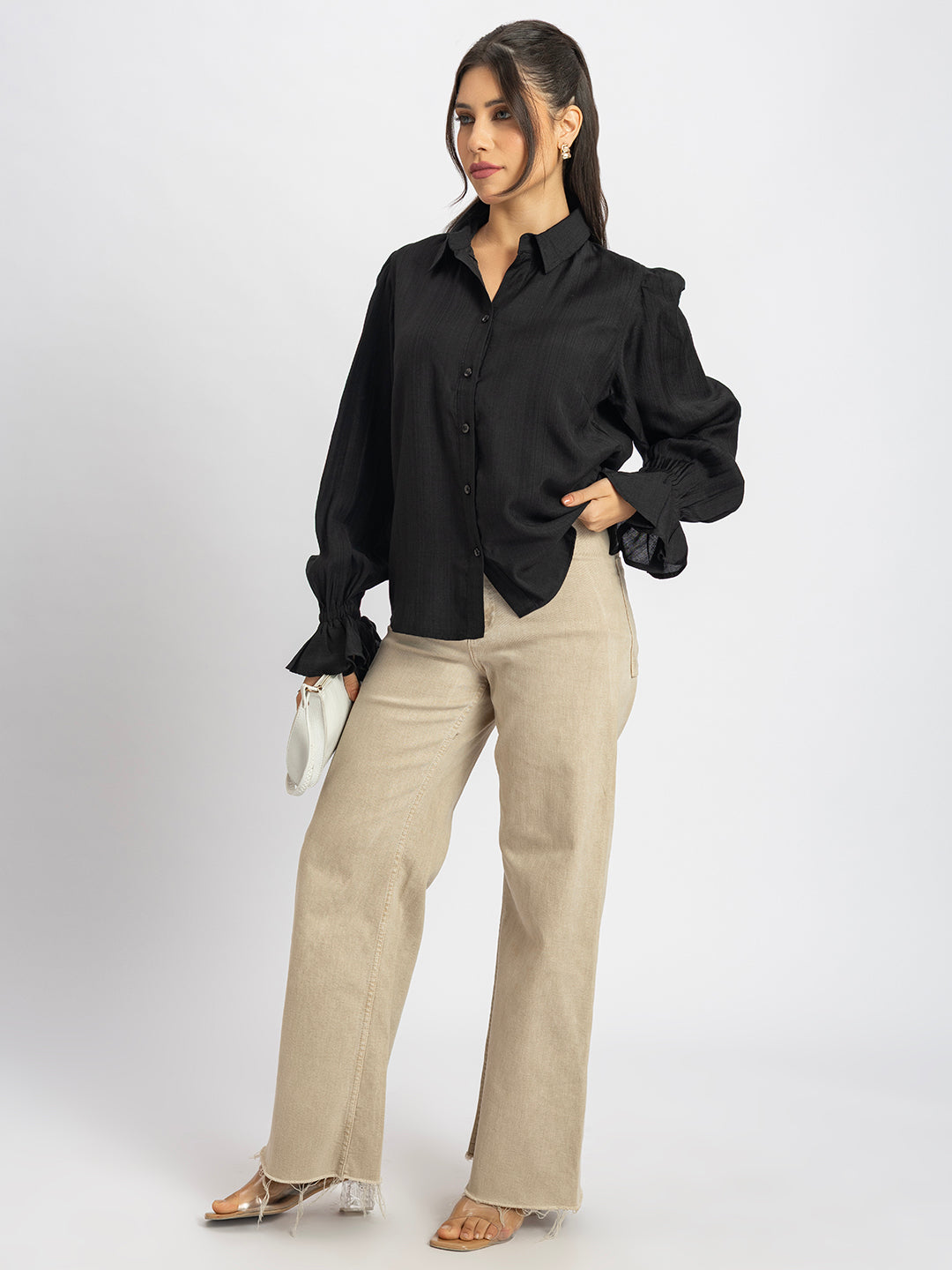 Detail of spread collar on black ruffled cuff shirt