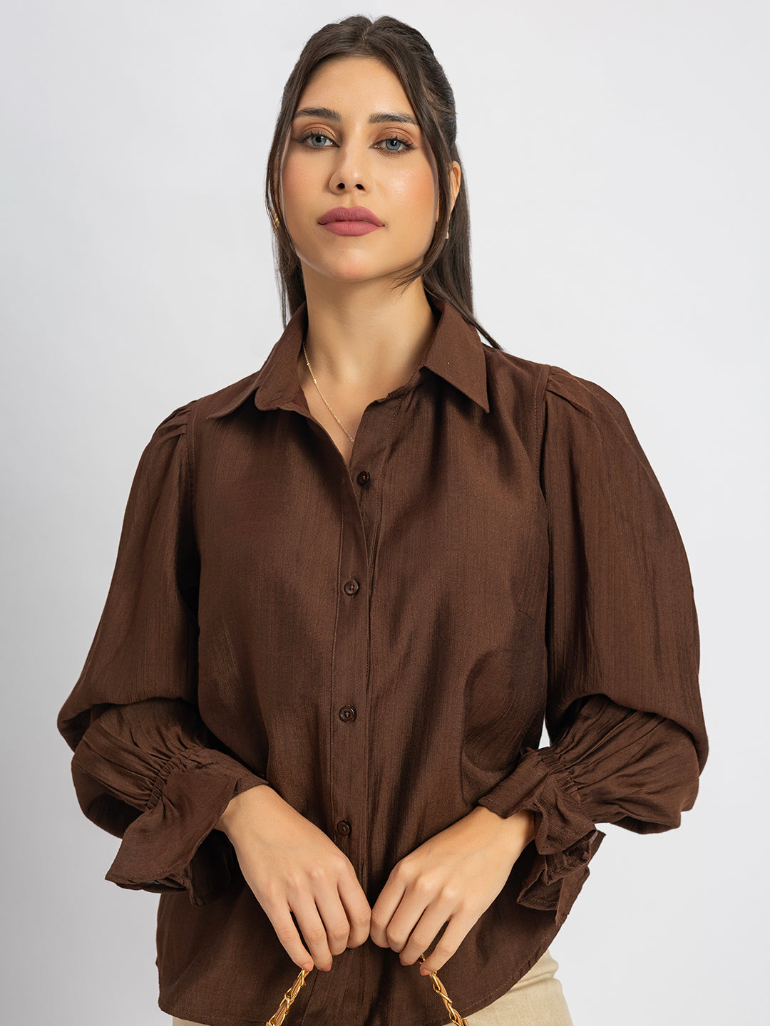 Side view of brown ruffled cuff shirt with spread collar