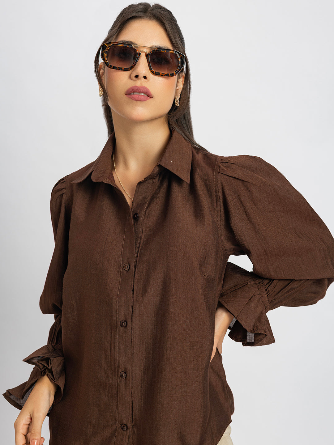 Front view of brown ruffled cuff shirt for women