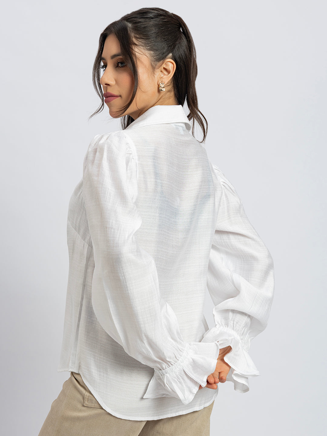 Lifestyle shot of white ruffled cuff shirt