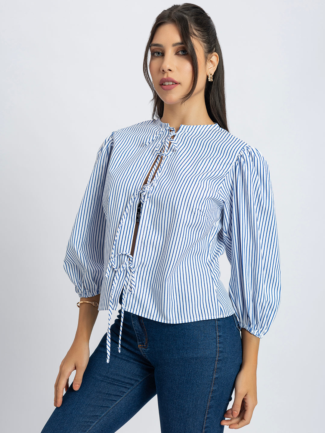 Lifestyle shot of woman wearing striped string top