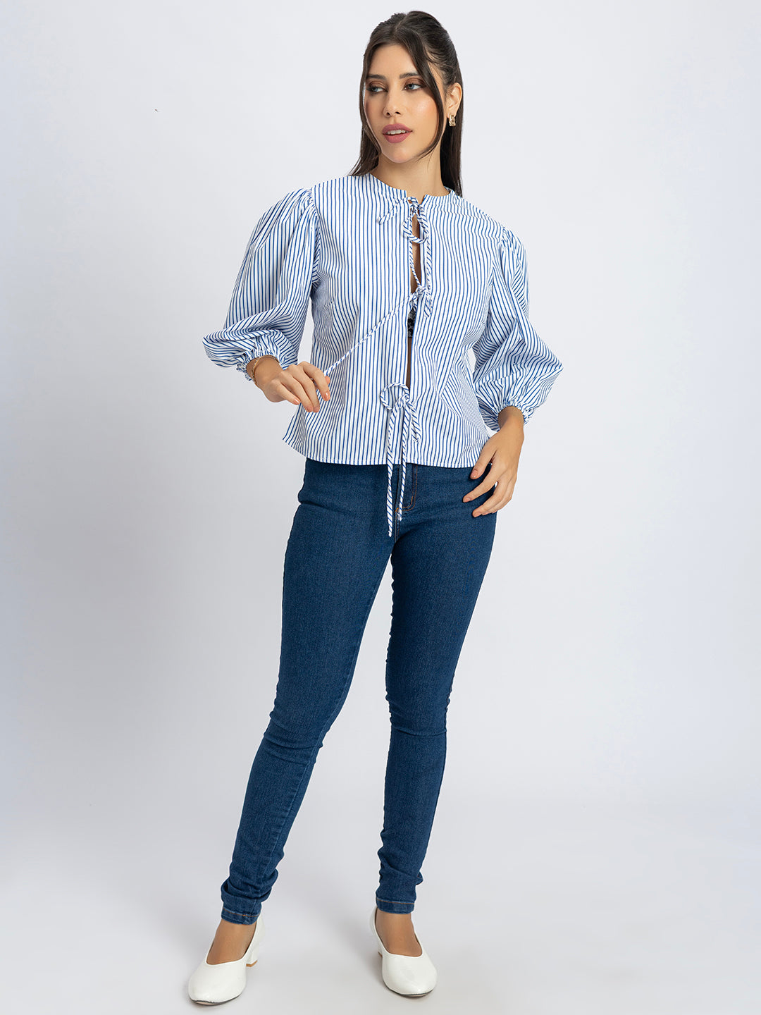 Close-up of stripe pattern on white and blue string top