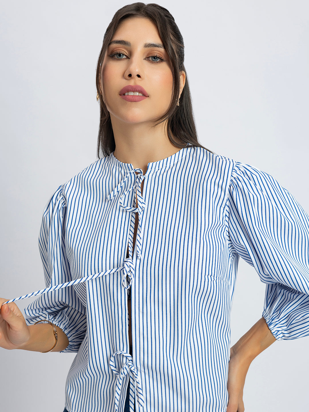 Styling shot of striped string top with denim