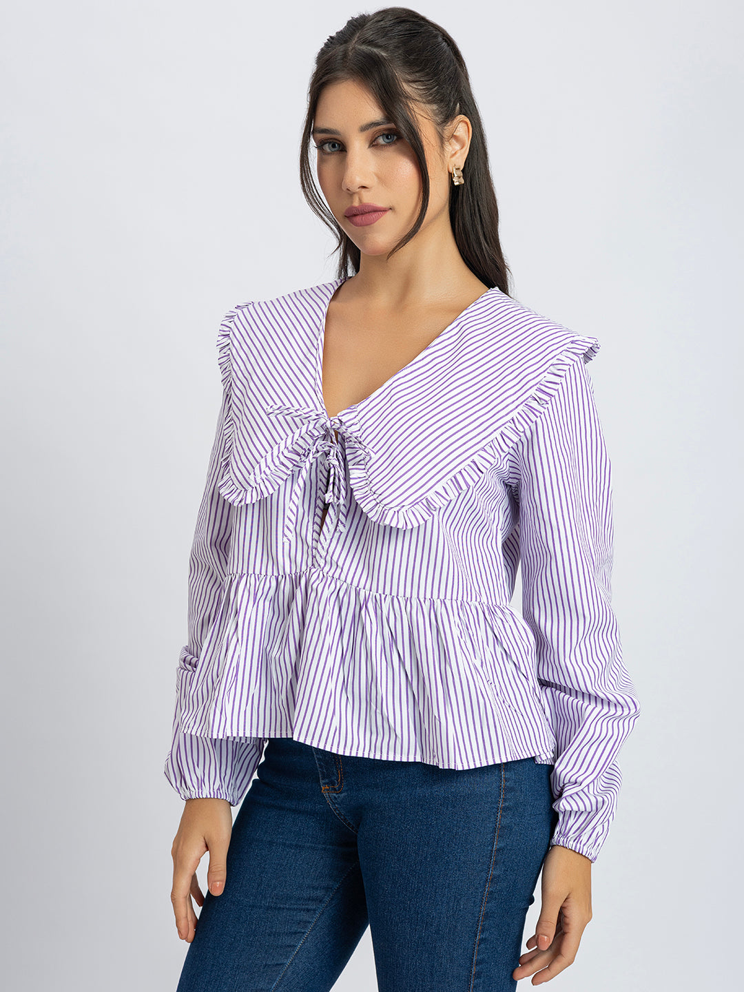 Detail of long sleeves on white and purple striped top