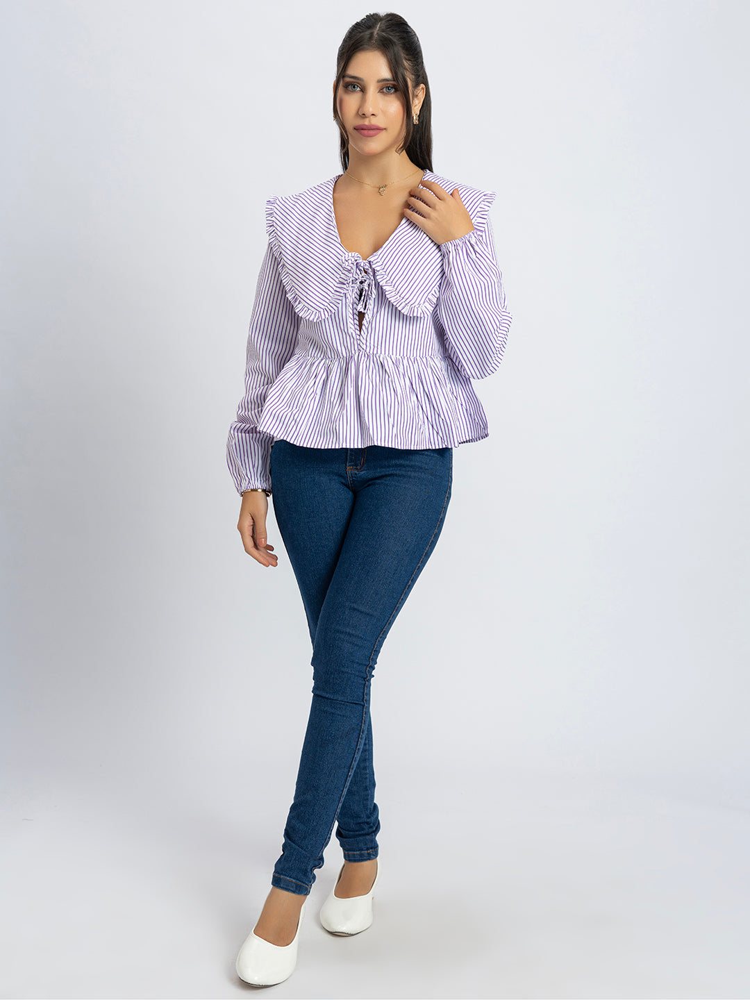Close-up of frill collar detail on striped peplum top