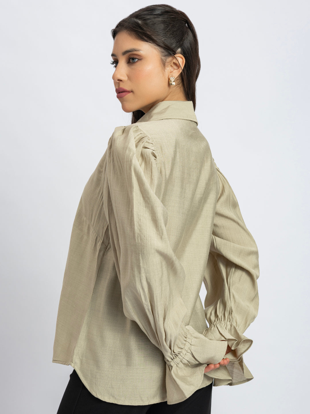 Back view of beige ruffled cuff shirt