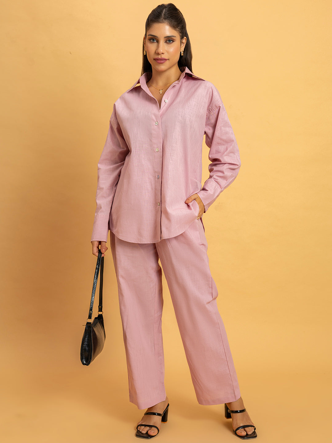 Detail of spread collar on pink linen co-ord shirt