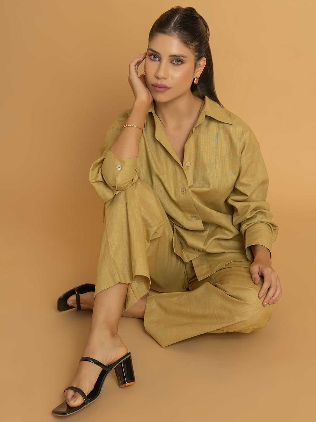 Styling shot of beige linen blend co-ord with accessories