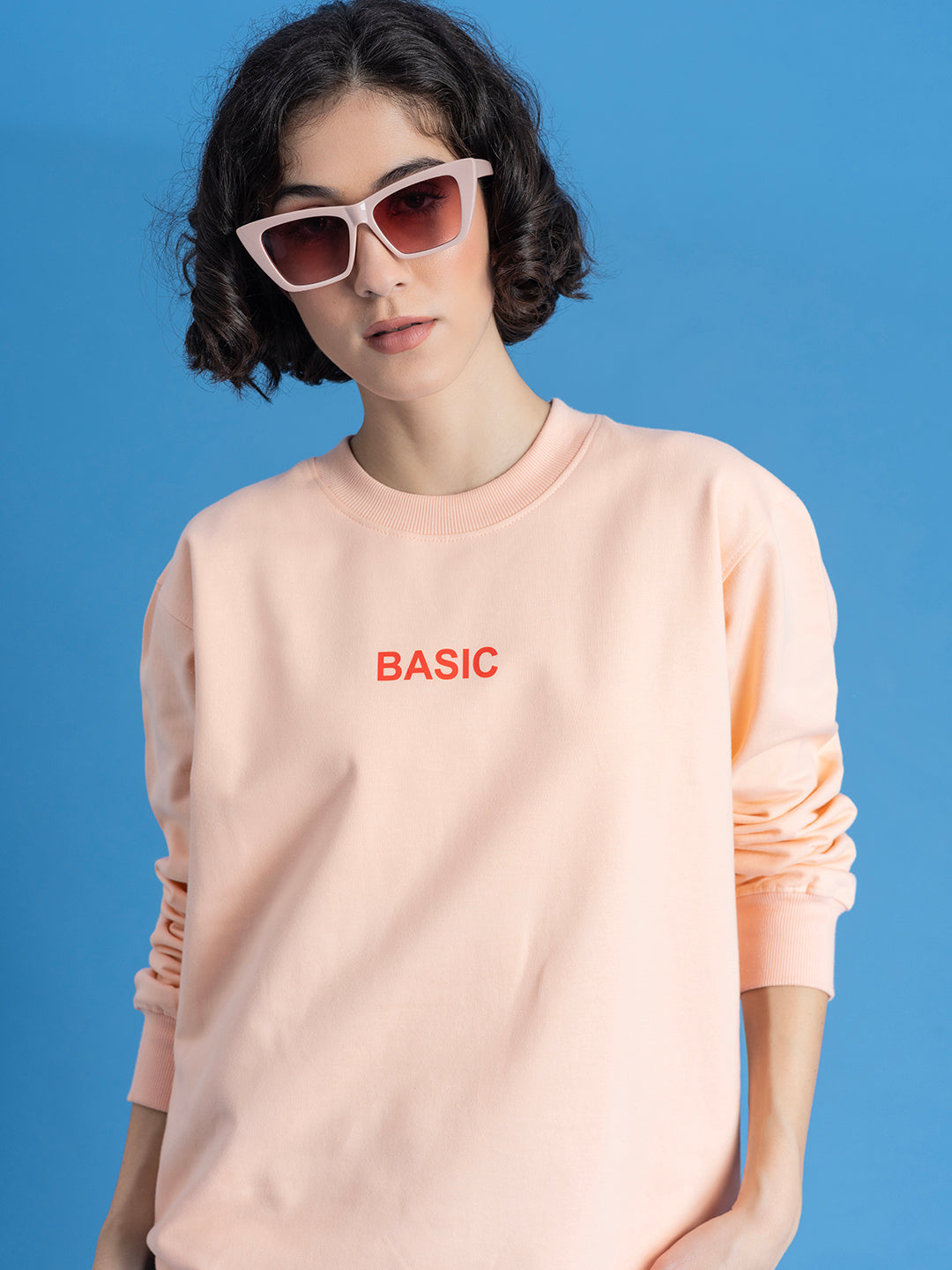 Front view of peach cotton blend sweatshirt with crew neck