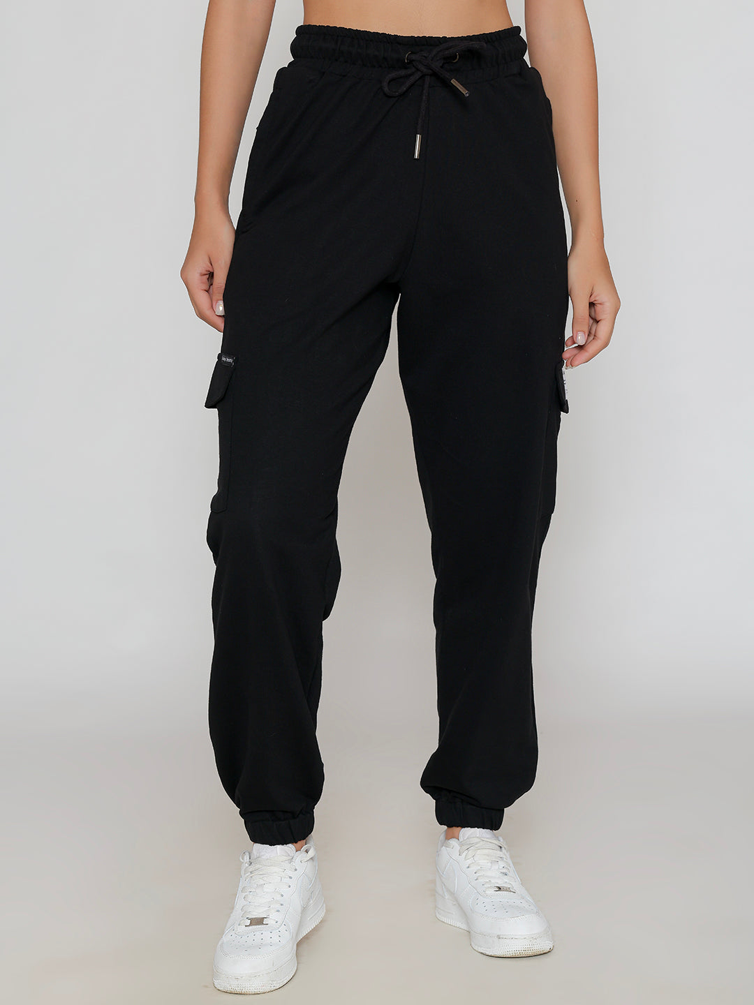 Front view of black multi-pocket cotton cargo pants