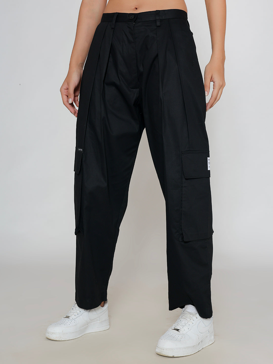 Detail of cargo pocket on black cotton pants