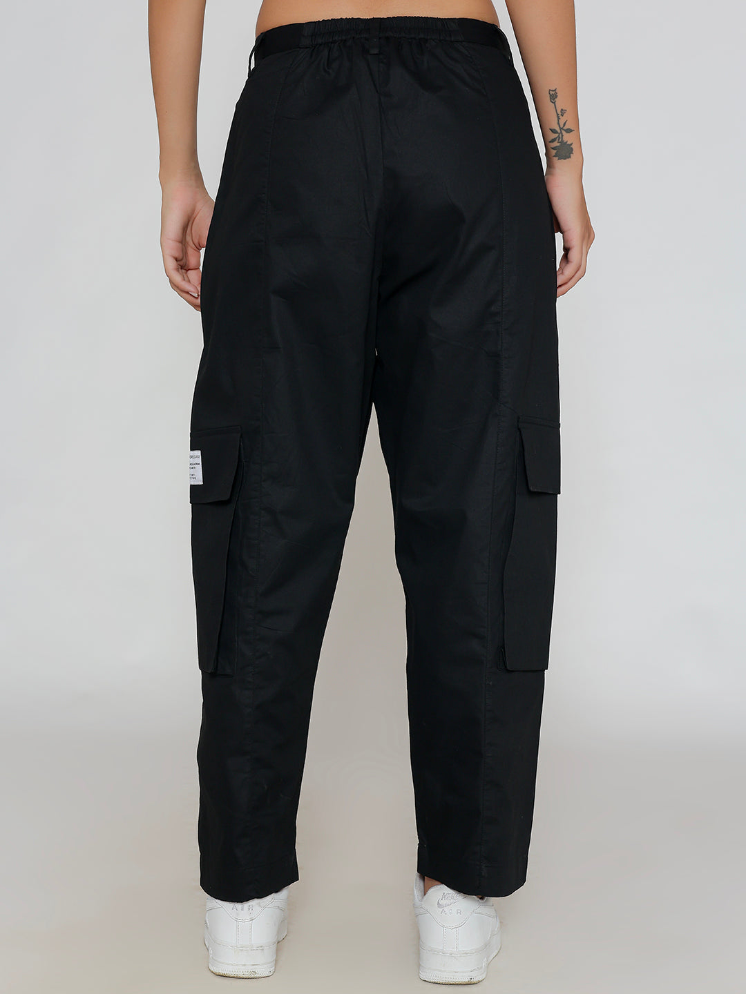 Close-up of elastic waistband on black cargo pants