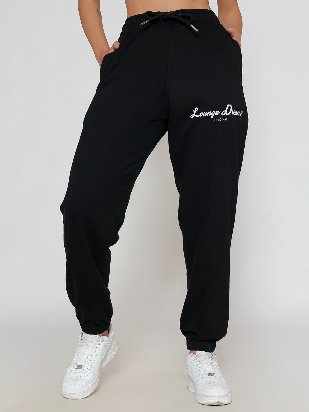Front view of black cotton knit joggers with tapered leg