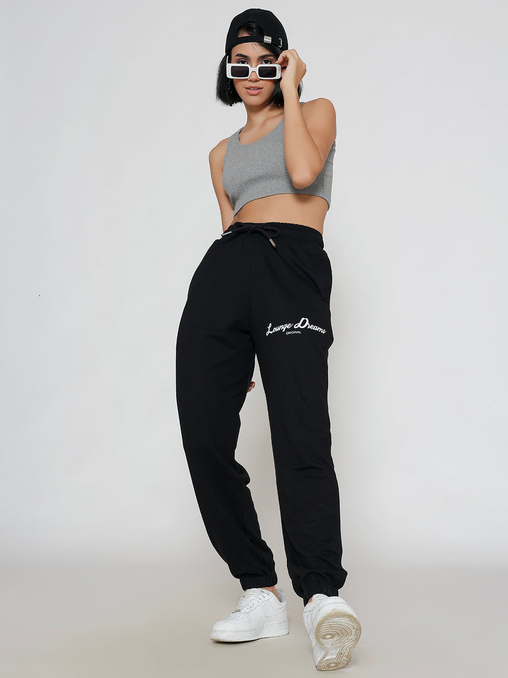 Side view of black cotton joggers showing pocket