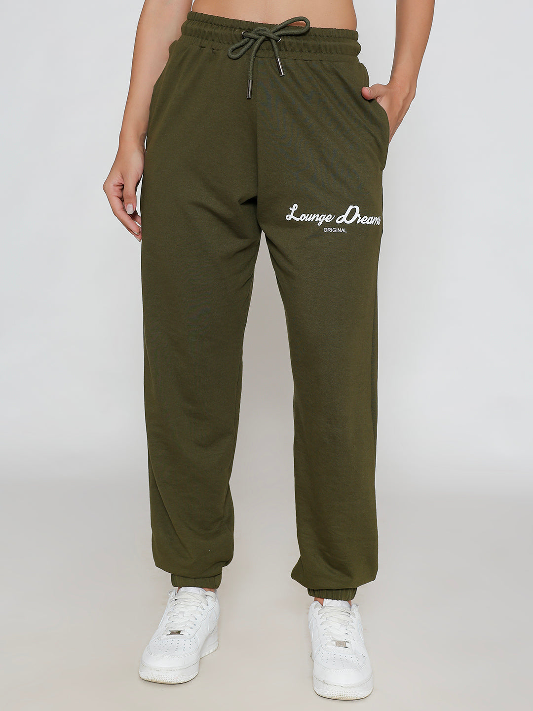 Detail of cuffed hem on olive cotton joggers