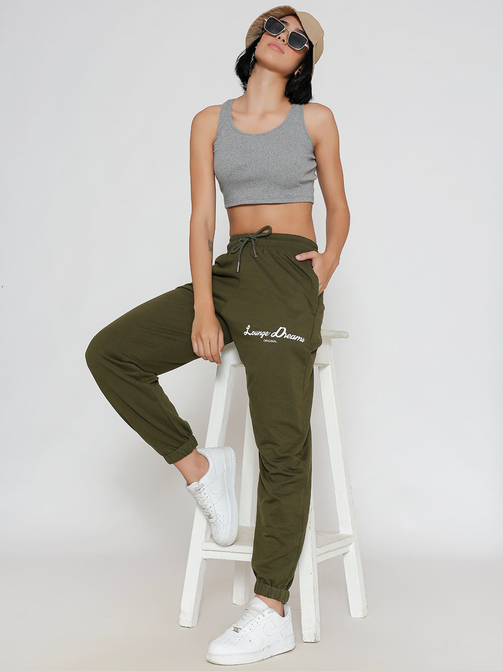 Side view of olive cotton joggers showing pocket