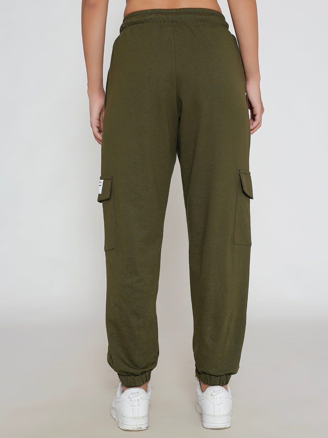 Close-up of elastic waistband on olive cargo pants