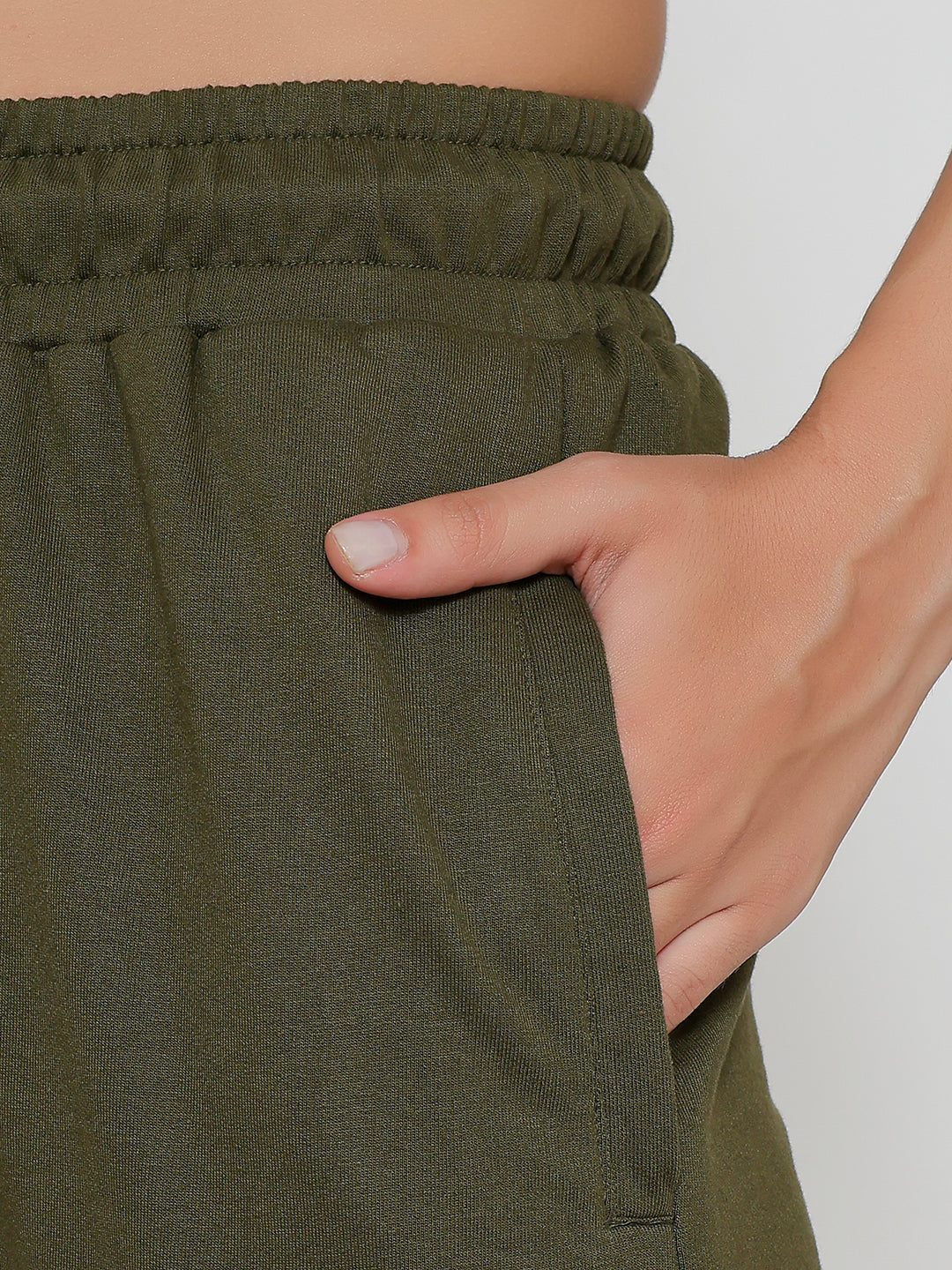 Lifestyle shot of olive cargo pants with a tee