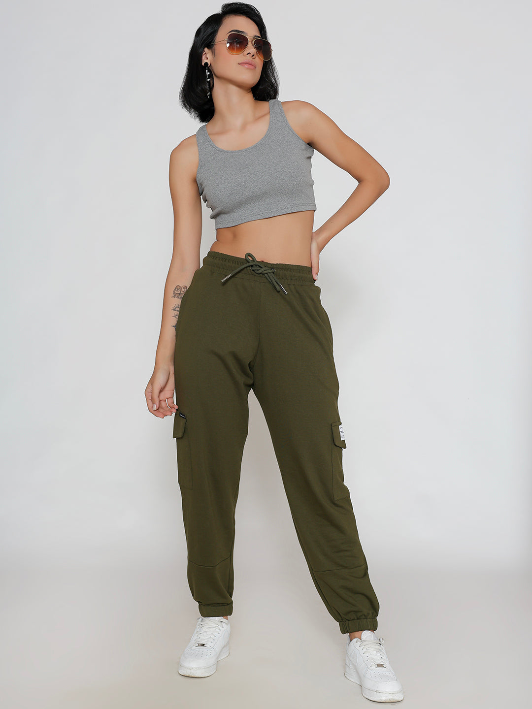 Olive cargo pants styled with sneakers